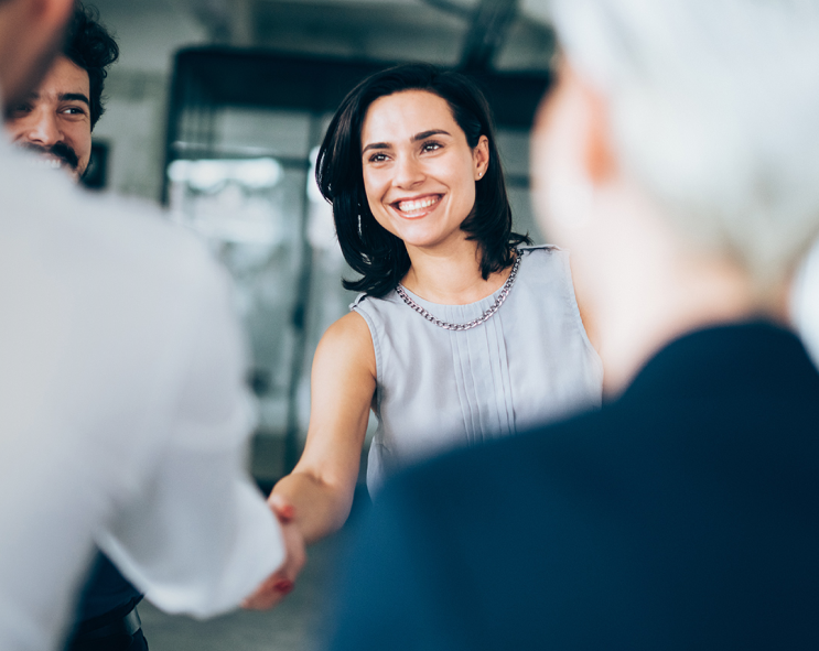 Smiling lady shaking hand